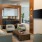 a room with seating and a tv on the wall