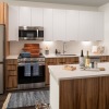 kitchen with a white countertop and stainless steel appliances 